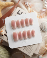 Rosy Glow pink aurora cat-eye press-on nails in short coffin shape