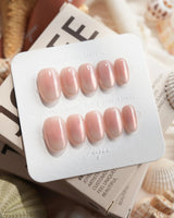 Rosy Glow pink aurora cat-eye press-on nails in short oval shape