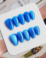 Royal Blue press-on nails in extra short almond shape — Deep Starry Blue, Cat Eye Glossy Effect.