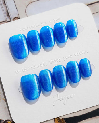 Royal Blue press-on nails in extra short oval shape — Deep Starry Blue, Cat Eye Glossy Effect.