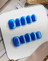 Royal Blue press-on nails in extra short squoval shape — Deep Starry Blue, Cat Eye Glossy Effect.