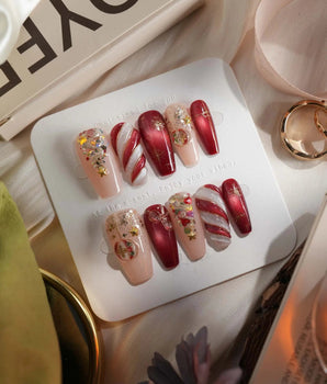 Ruby Night press-on nails in medium coffin shape — Glitzy Red & Gold Christmas, 3D Cat-eye Swirls & Glitter Christmas Trees.