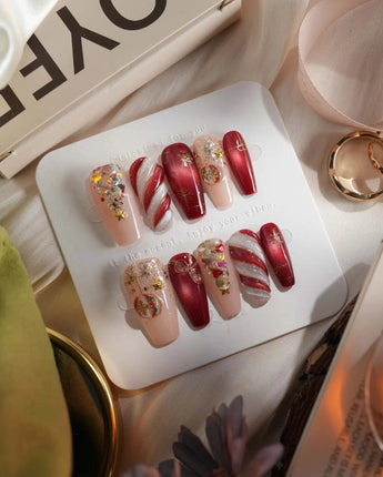 Ruby Night press-on nails in medium coffin shape — Glitzy Red & Gold Christmas, 3D Cat-eye Swirls & Glitter Christmas Trees.