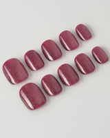 Ruby Red Cat-eye press-on nails in extra short squoval shape — ruby red magnetic nails
