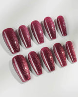 Ruby Red Cat-eye press-on nails in medium coffin shape — ruby red magnetic nails