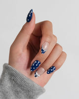 Sailor Dot custom-size extra short almond nails with navy dots and pearl details