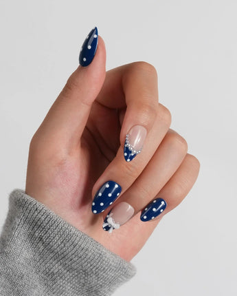 Sailor Dot custom-size extra short almond nails with navy dots and pearl details