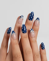 Sailor Dot extra short almond nails with preppy navy-and-nude polka dot design