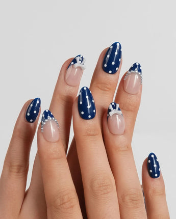 Sailor Dot extra short almond nails with preppy navy-and-nude polka dot design