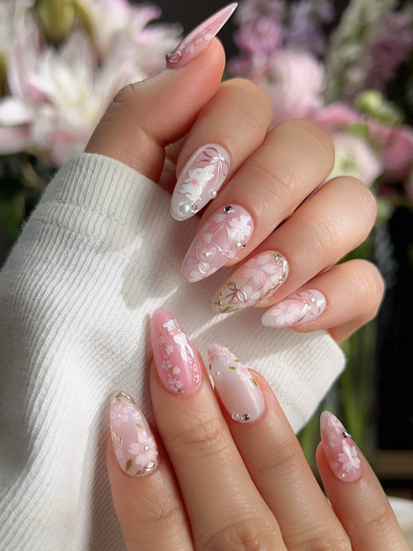 Sakura-Cipher handmade press-on nails featuring Sweet Cherry Blossom Pink, Hand-painted Bunnies & Metallic Butterfly Wings.