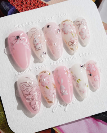 Sakura-Cipher nails in medium almond — Sweet Cherry Blossom Pink,