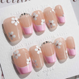 Sakura Fall press-on nails in short coffin shape — Pink French, White Floral.