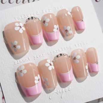 Sakura Fall press-on nails in short coffin shape — Pink French, White Floral.