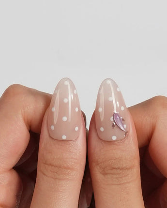 Salt & Sand custom-size beach nails with sandy nude polish and shiny sea charms