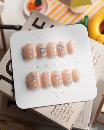 Salt & Sand extra short squoval nails with metallic starfish and sea-foam dots