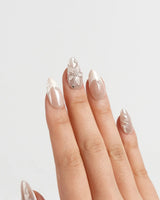 Satin Dress press-on nails in short almond shape — nude pink pearl sheen 3D floral ribbon embossed