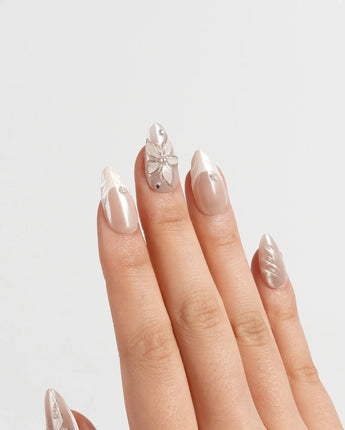 Satin Dress press-on nails in short almond shape — nude pink pearl sheen 3D floral ribbon embossed
