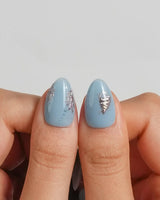 Sea Chrome jewelry-like ocean nail art with chrome starfish, shells, and blue gel base