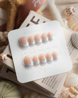 Sea Salt extra short squoval nails with soft icy blue French tips