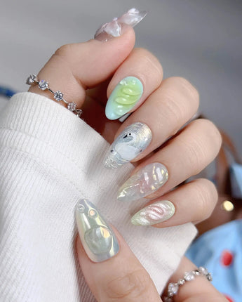 Seaglass Swan close-up of pastel seaglass nails with 3D flowers and swan detail