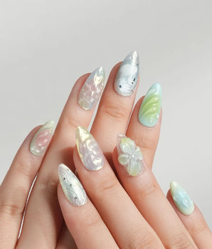 Seaglass Swan short almond nail set with seaglass shimmer and sculpted florals
