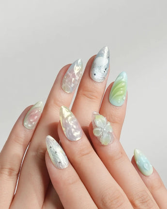 Seaglass Swan short almond nail set with seaglass shimmer and sculpted florals