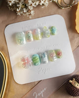 Seaglass Swan press-on nails with early-morning lagoon tones and 3D florals