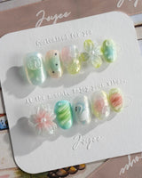 Seaglass Swan hand-painted nails with iridescent blue-green pastels and swan detail