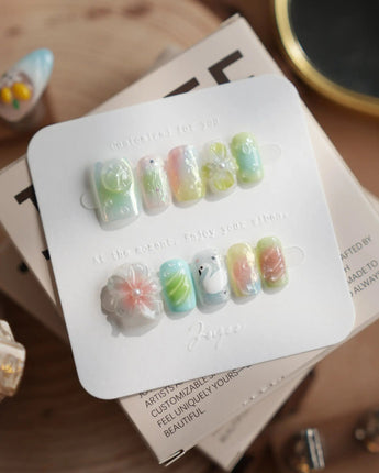 Seaglass Swan medium square nails with seaglass shimmer, 3D florals, and swan art