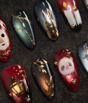 Séance gothic press on nails with a mask, dripping candles, lantern, skull and dagger on jewel tone cat eye with gold studs - image 1