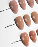 Sheer Look Team #1 handmade press-on nails featuring nude cat eye