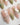 Shell Blossom handmade press-on nails featuring Gentle Pink & Green Gradient, Shell Fragment Petals & Hand-painted Leaves.
