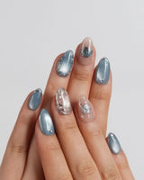 Shell Money extra short almond set with silver shells on sandy nude and blue gel