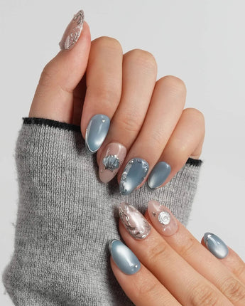 Shell Money extra short almond nails with sculpted conch shells and coral branches