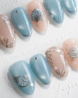 Shell Money liquid silver seashell nails with dusty blue and pearl accents