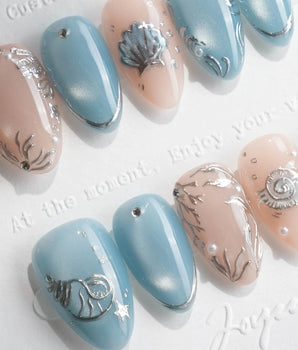 Shell Money liquid silver seashell nails with dusty blue and pearl accents
