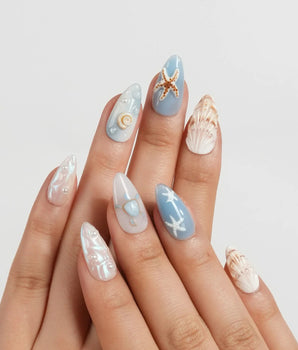 Shell Picking ocean-themed nail set with starfish, conch shells and pearl droplets