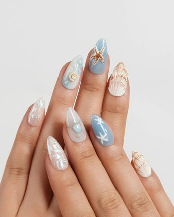 Shell Picking ocean-themed nail set with starfish, conch shells and pearl droplets