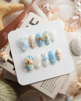 Shell Picking extra short almond press-on nails with seashells and starfish accents