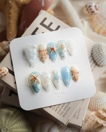 Shell Picking short stiletto press-on nails with blue jelly ocean shell art