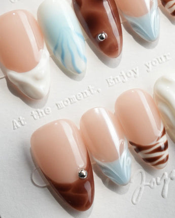Shore Blend clean summer nails with architectural color blocks and glossy finish