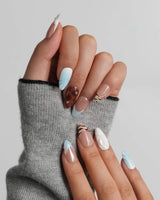 Shore Blend handmade coastline-inspired nails with chocolate brown and icy blue panels