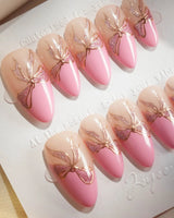 Gorg Bow nail art close-up showing Sweet Barbie Pink, Golden Outlined Glitter Bows & French Patchwork Design. details