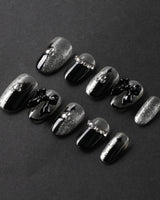 Gorgeous Gown press-on nails in short oval shape — black white gradient rhinestone bow y2k nails