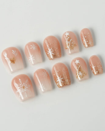 Silent Night press-on nails in extra short coffin shape — Champagne Gold Glitter, Christmas Reindeer & Snowflakes.