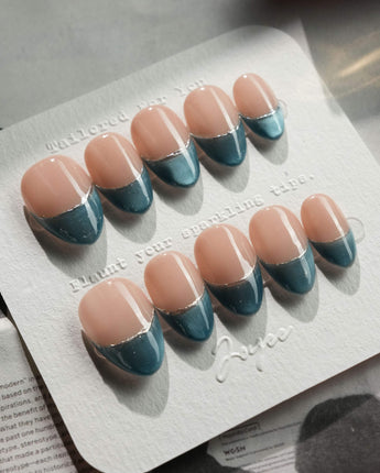 Silk Azure press-on nails in extra short almond shape — Ice Blue Cat Eye, French Silver Wire.