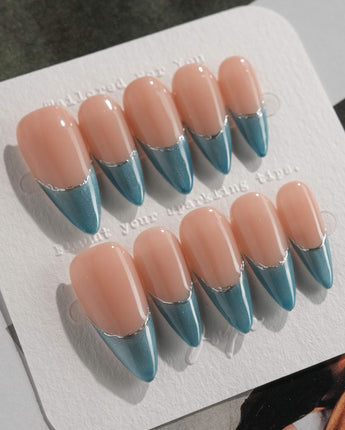Silk Azure press-on nails in medium stiletto shape — Ice Blue Cat Eye, French Silver Wire.