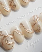 Silk Bow handmade press-on nails featuring Luxury Creamy White & Gold, 3D Champagne Gold Wire Bows & Fine Shimmer.