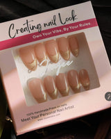 Silk Glow nail set with pale gold magnetic shine and fine metallic French linework