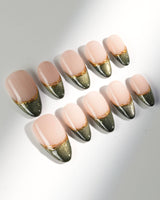 Silk Green press-ons with rich green shimmer, French tip shape, and fine gold detail